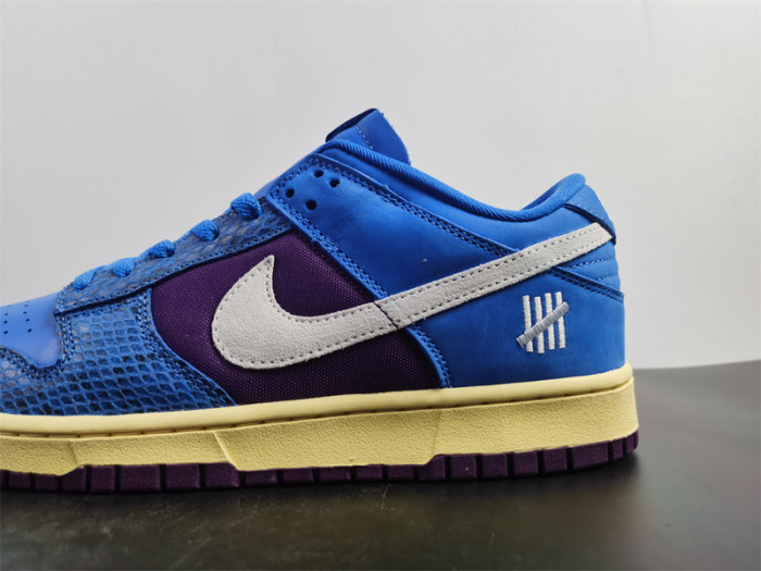 undefeated’s “dunk vs. af-1” collection grows with this snakeskin-dressed   dh6508-400