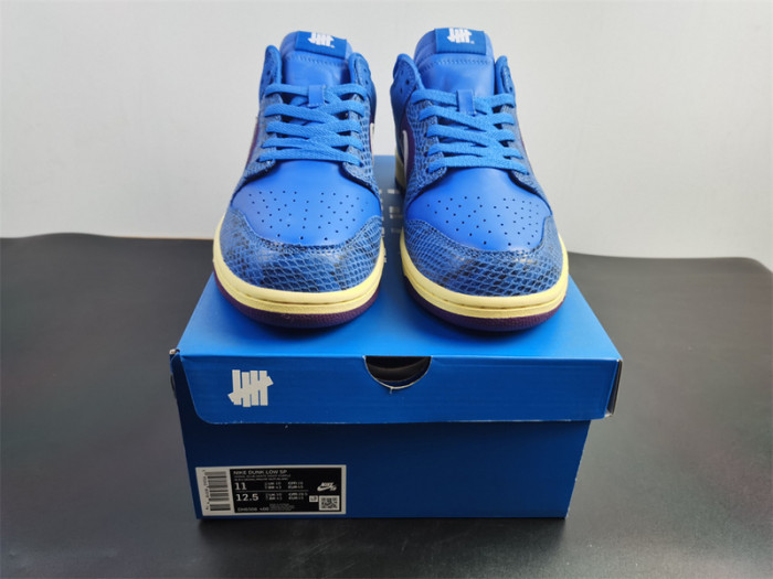 undefeated’s “dunk vs. af-1” collection grows with this snakeskin-dressed   dh6508-400